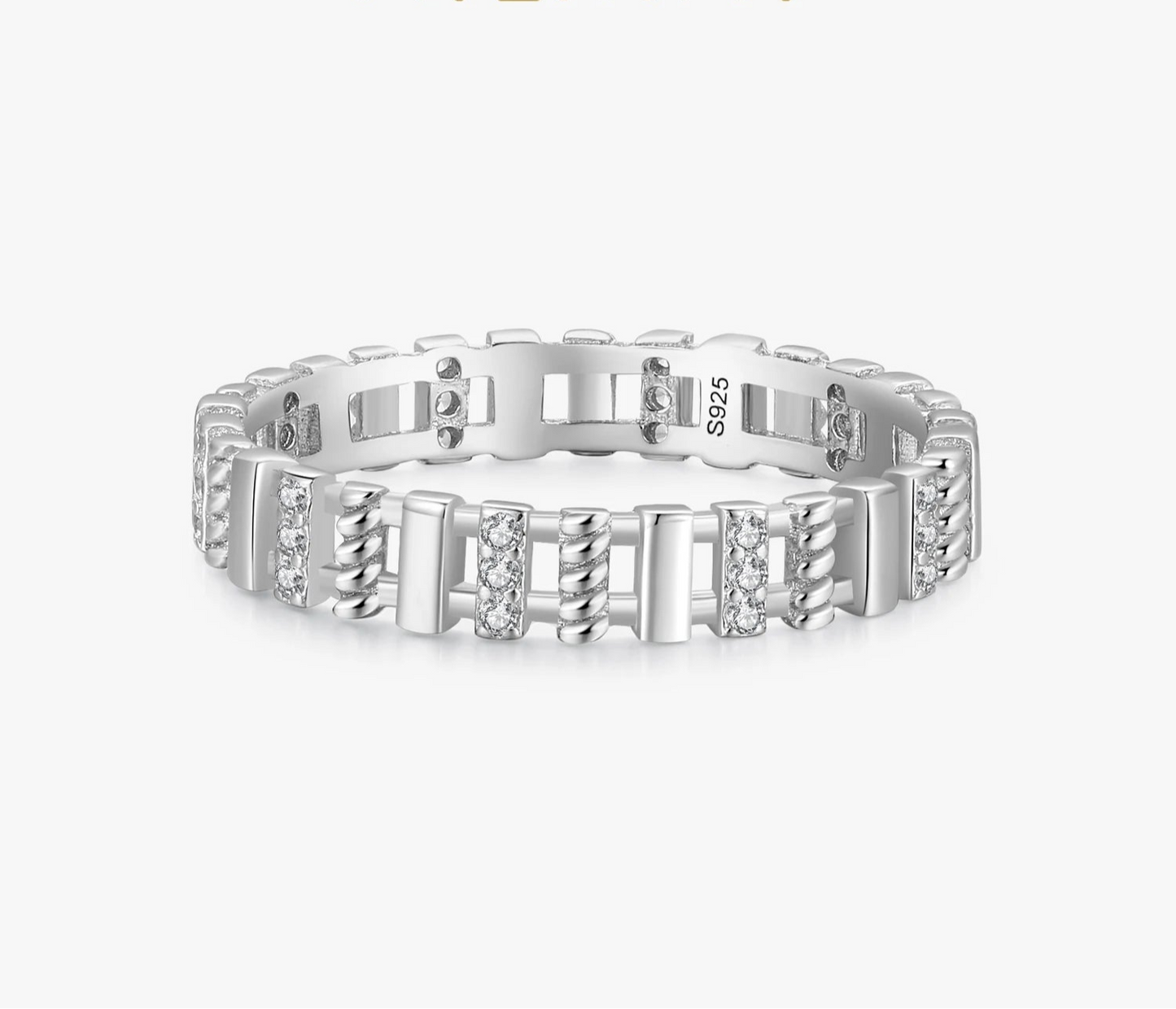 Silver ring with diamond accents on a white background