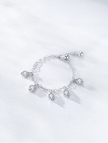 Silver bracelet with charms on a white background