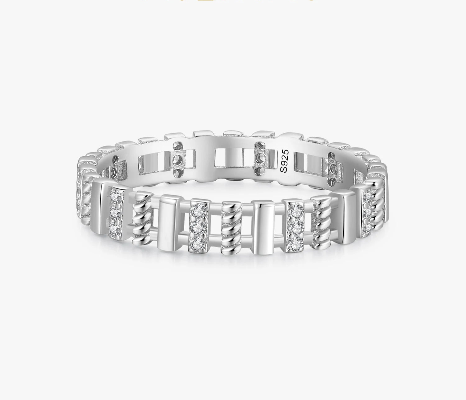 Silver ring with diamond accents on a white background