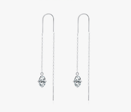Silver earrings with crystals on a white background